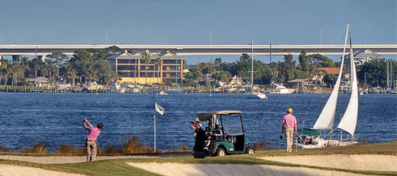Golfers playing at the Floridian National Golf Club, a premier destination for shipping golf clubs and golf travel with BagCaddie.