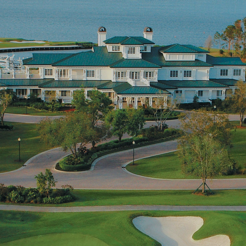 Aerial view of the Floridian National Golf Club clubhouse and course, a premier destination for shipping golf clubs and luggage with BagCaddie.